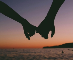 Holding hands at beach