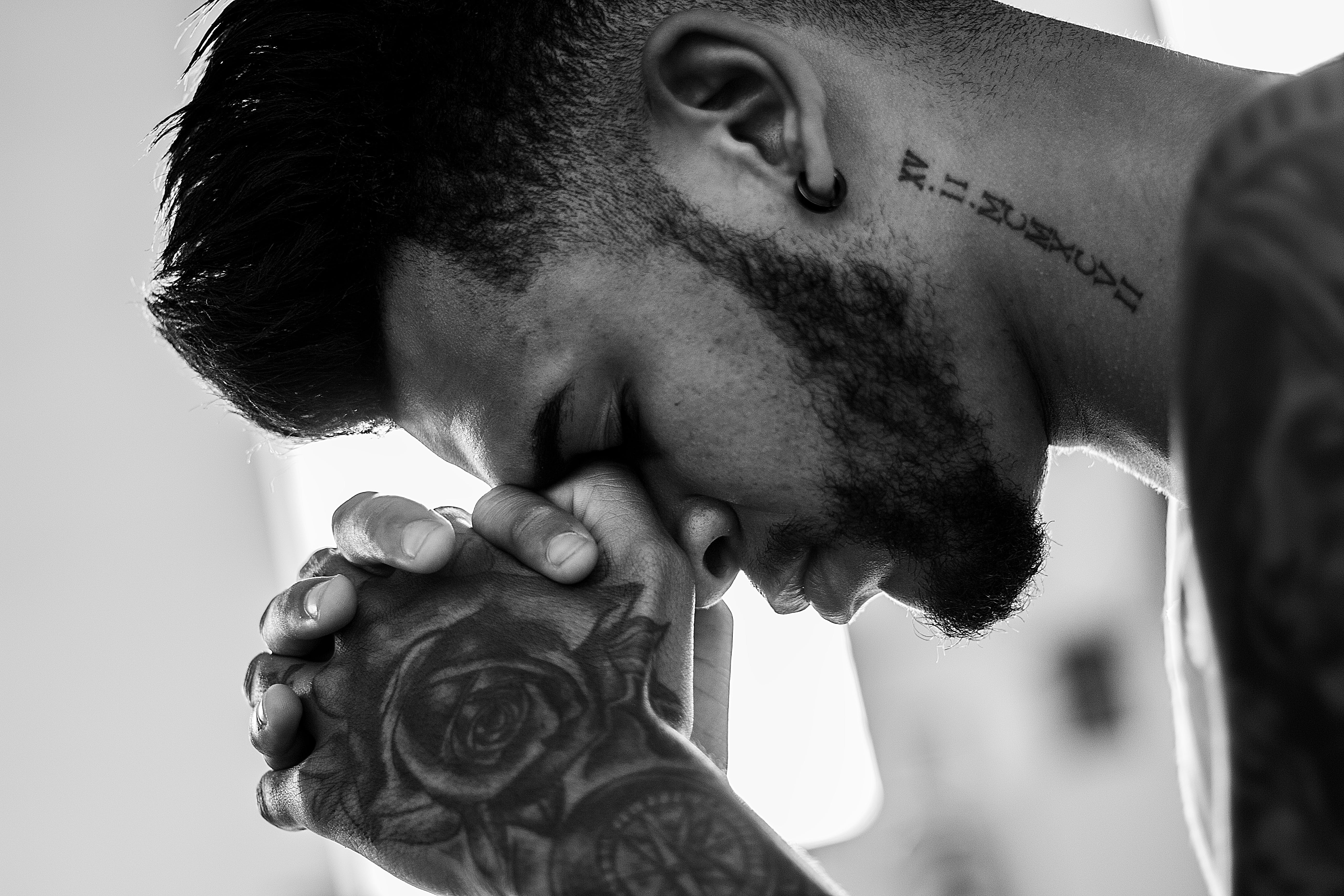 Tatted guy praying